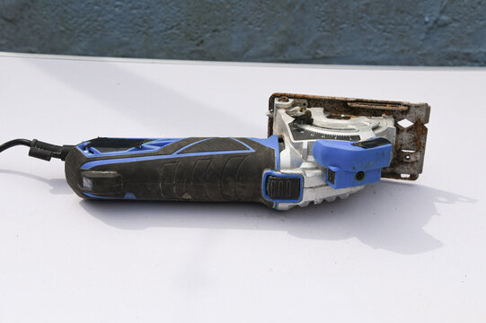 Close-up footage of a handheld circular saw cutting 