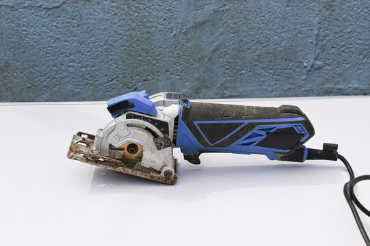 Close-up footage of a handheld circular saw cutting 