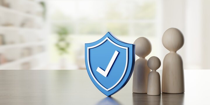 Abstract wooden pawn figure family with blue shield with checkmark on table in front of living room background, family home insurance, security or protection concept with copy space, selective focus