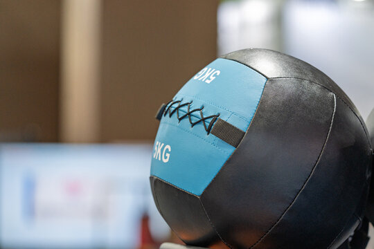 close up view of five kilogram fitness medicine ball in gym