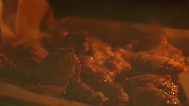 Cooking chicken in the oven. Chicken thighs on a baking sheet in the oven