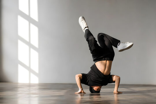 Breakdancer Performing Headspin in Studio