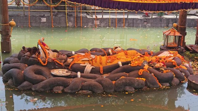 Reclining Lord Vishnu Statue at Budhanilkantha Temple in Kathmandu, Nepal, Sleeping Vishnu on Serpent Shesha in Sacred Pond, Hindu Religious Heritage and Pilgrimage Site