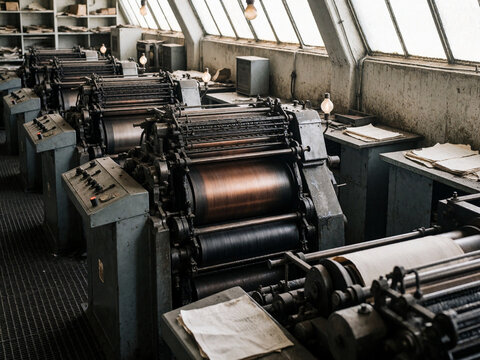 Vintage Industrial Printing Presses in Old Factory Hall