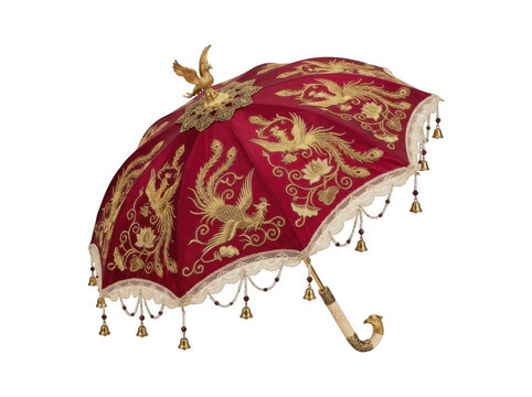 Ornate red and gold embroidered velvet parasol with hanging bells isolated on white background umbrella accessory