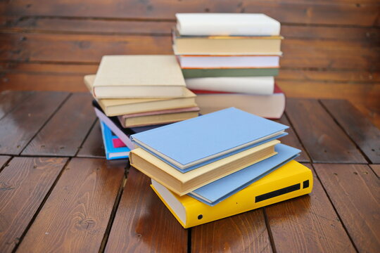 stack of books against the background of library, stack of books in front of library, books on wooden table, education, High quality book photography, Best Book Photo

