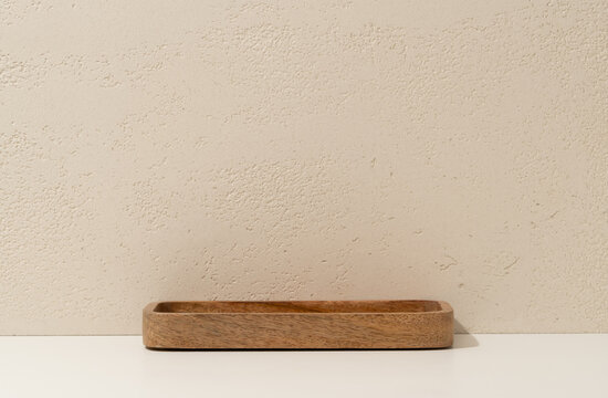 Empty Wooden Tray on White Shelf Against Travertine Wall Background with Copy Space