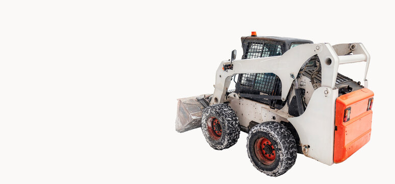 Compact skid steer loader features large tires and a front bucket, set against a clean white background, ideal for construction and industrial applications