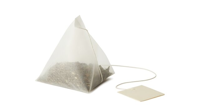 Single pyramid tea bag with tag for herbal drink