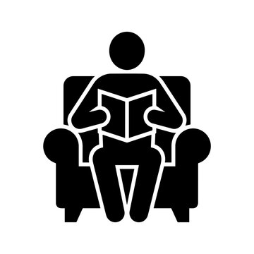 Reading featuring a human figure sitting in a comfortable armchair while holding and reading an open book, representing education