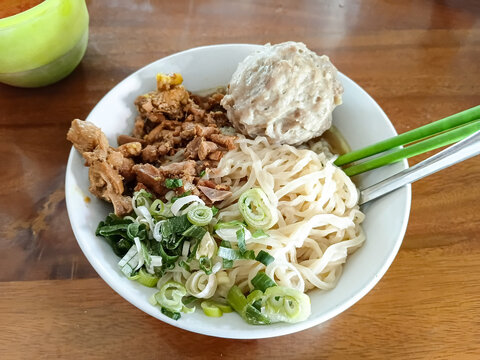 Mie ayam bakso or Traditional Indonesian chicken noodles, served with meatball and seasoned chicken