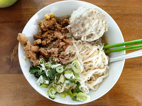 Mie ayam bakso or Traditional Indonesian chicken noodles, served with meatball and seasoned chicken