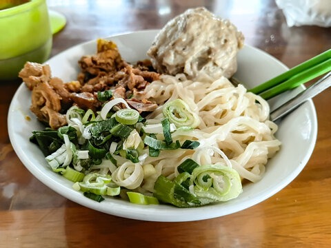 Mie ayam bakso or Traditional Indonesian chicken noodles, served with meatball and seasoned chicken