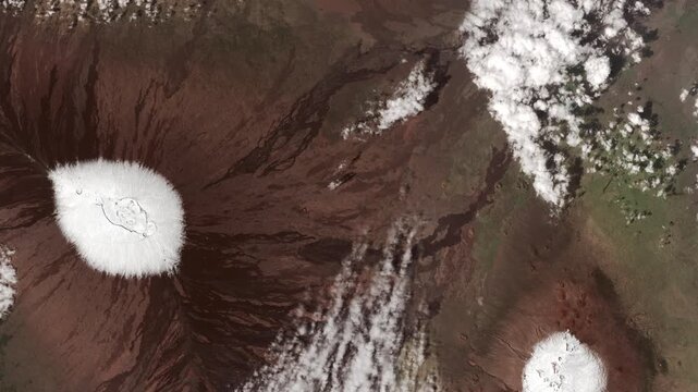 Aerial view on volcanoes covered with snow. Camera is moving backward and left. Animation based on image by NASA