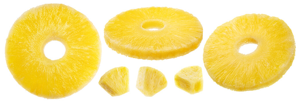Pineapple rings and pineapple pieces isolated on a white background.