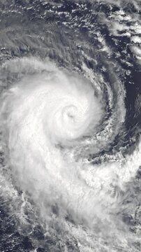 Panoramic shot on cyclone above ocean. Weather change, bad weather concept. Camera is moving forward. Vertical video. Animation based on image by NASA