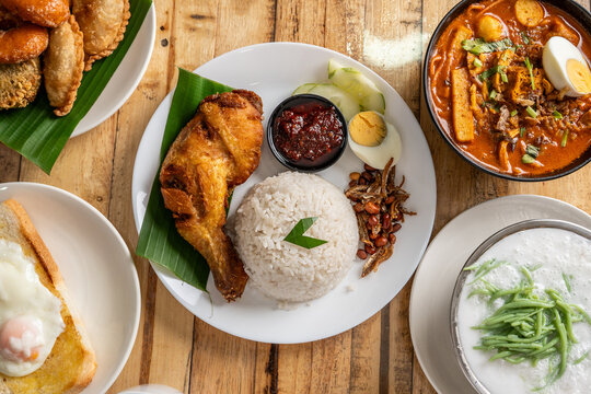 Traditional Malaysian Nasi Lemak with Fried Chicken and Curry Laksa