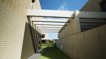 Fototapeta premium Modern concrete and brick architecture creating an outdoor space with pergolas, geometric shadows, and green grass