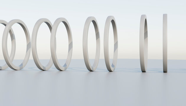 A minimalist sequence of white rings in a clean studio setting
