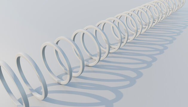 White continuous spiral ring casting repeating shadows on a white