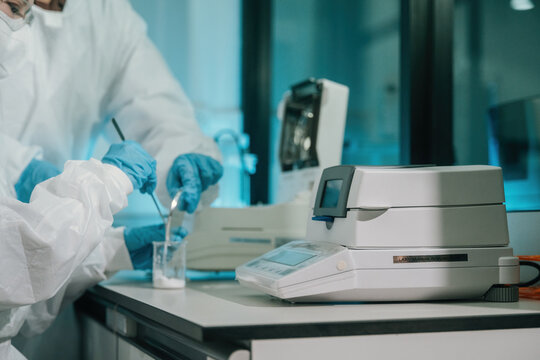 Close up of Scientist Using Moisture Analyzer in Pharmaceutical or Food Quality Control Laboratory