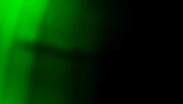 Abstract green glowing light with shadow effects on dark background