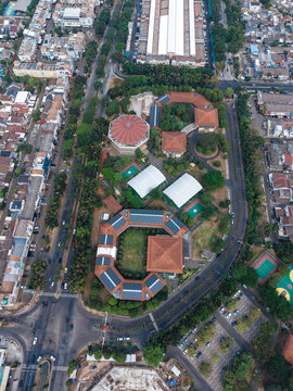 Aerial view of the unique architectural complex near Jalan Letnan Sutopo with its distinctive octagonal building and green courtyards in Kecamatan Serpong, Banten, Indonesia.