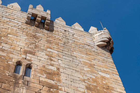 Chaves Castle stone wall and battlements under a blue sky The Concept of historical heritage