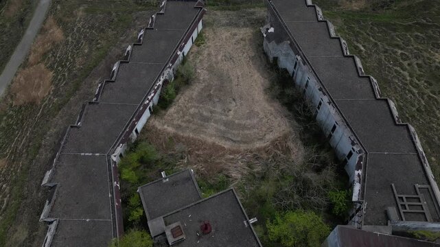 Aerial Drone View of Abandoned Himiko no Sato Resort Hotel in the Aso Grasslands, Kumamoto Japan