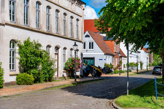 Friedrichstadt, Germany - Blooming front gardens, traditional street lamps and classic architecture highlight the charm of this northern German canal town.