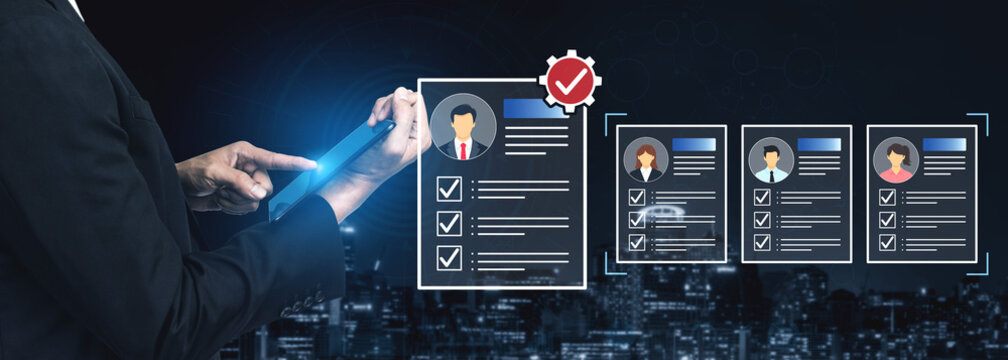 Business Professional Reviewing Candidate Profiles on Digital Device with City Skyline Background and Graphical Interface Elements. Bitwise.