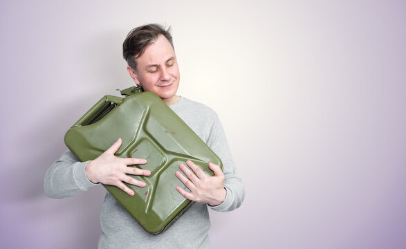 Contented man hugging a gasoline canister with closed eyes, expressing relief and happiness after obtaining scarce fuel, symbolizing fuel shortage, energy crisis and resource scarcity today