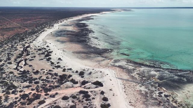 Scenic aerial panorama of Hamelin Pool WA highlighting coastline and shallow marine flats