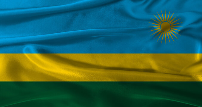 Flag of Rwanda with fabric textured background. Close up of National flag of Rwanda with realistic texture