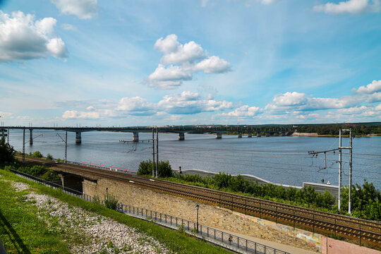 Embankment and bridge over the Kama River on a clear sunny day, Perm. Sights of Russia, World tourism.