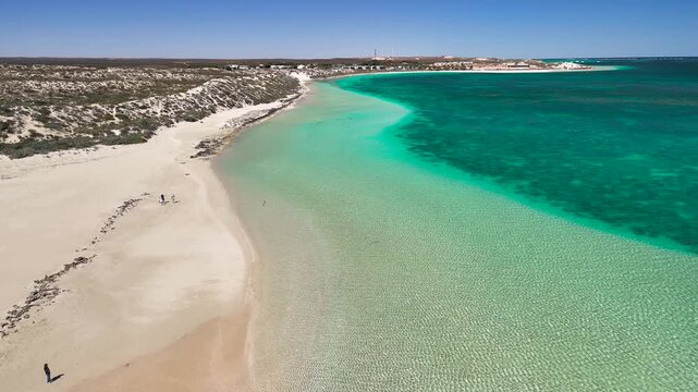 Drone photography of Coral Bay with panoramic view of beach, reef, and sea