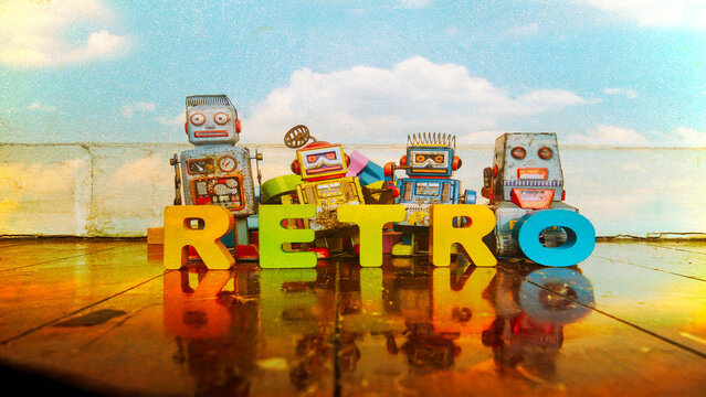 RETRO word with retro roys on a wooden floor and postcard sky 
