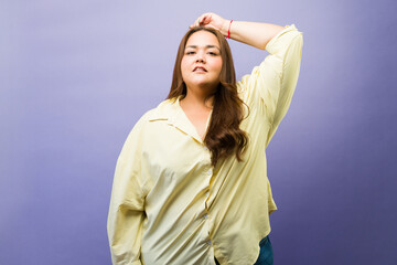 Naklejka premium Woman standing with confidence, embracing her body, showing self-love and contemporary fashion