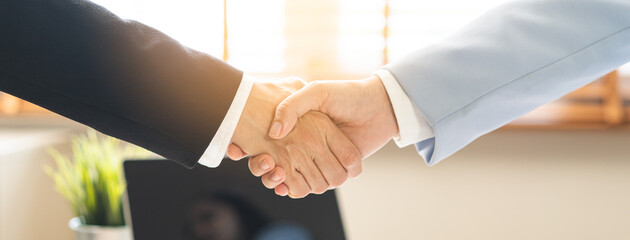 Successful deal asian young business woman, partnership, teamwork handshake or greeting together at office after project done, good deal. Happy business people, group meeting, colleagues shaking hands © KMPZZZ