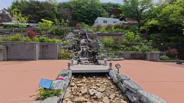 Stone rock garden sculpture on a plaza in Jaman Mural Village, Jeonju, South Korea.