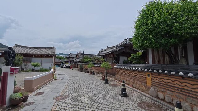 Narrow tree lined alley near Jaman Mural Village, Jeonju, South Korea.