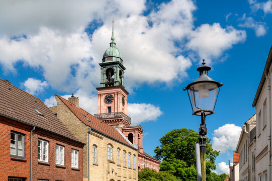 Friedrichstadt, Germany - Historic brick houses with a view of the distinctive Remonstrant church tower