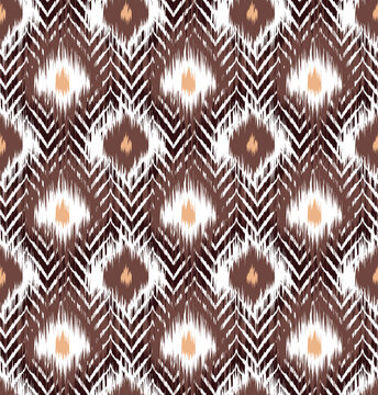 Seamless tribal ikat geometric pattern vector design in brown, white, and peach