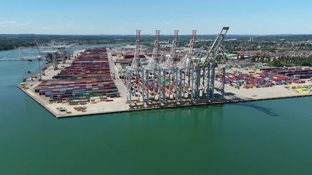Aerial View of Gantry Cranes and Vast Shipping Container Terminal on South Coast Port UK