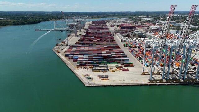 Aerial view of thousands of cargo shipping containers at Southampton port terminal UK