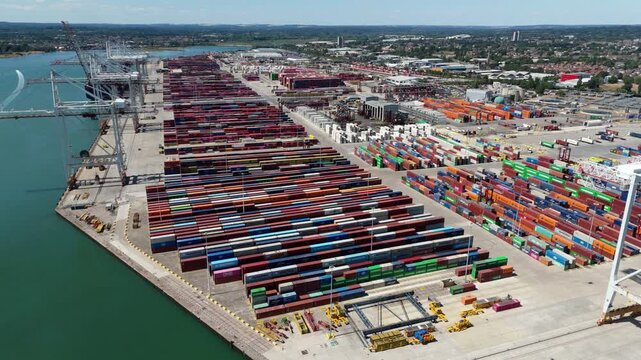 Aerial view of thousands of cargo shipping containers at Southampton port terminal UK