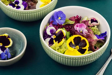 Colorful edible flower salad with mixed lettuce leaves © nikolaydonetsk