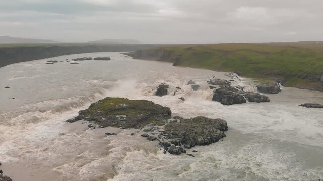 Drone view of Urridafoss waterfall and Icelandic landscape.