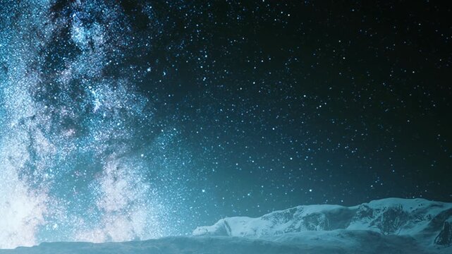 A clear view of the vast night sky shows countless stars shining brightly. The mountains are visible below, silhouetted against the light from the stars.