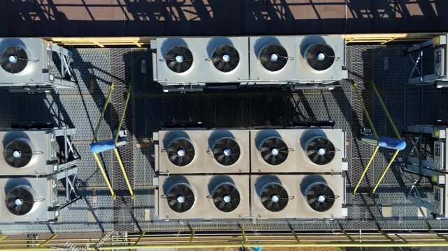 Close Up Aerial View of Data Center HVAC Cooling Fans in Rows on Rooftop for AI Servers in UK
